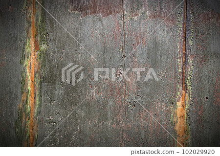 Old dark painted wood surface as background 102029920