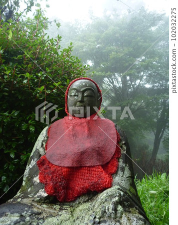 Vertical: Jizo statue on Mt. Takao in the early morning Vertical: Jizo statue on Mt. Takao in the early morning 102032275