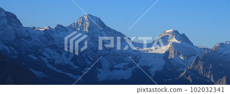 Mountains in the Lauterbrunnen Valley at sunrise. Mountains in the Lauterbrunnen Valley at sunrise. 102032341
