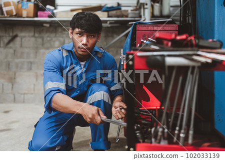 Expert auto mechanic repair and service customer service work on car at garage. automobile car concept 102033139