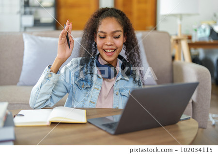 Portrait of African Americans using notebooks, pens to take notes and computers. to study through the Internet, online e learning concept Portrait of African Americans using notebooks, pens to take notes and computers. to study through the Internet, online e learning concept 102034115