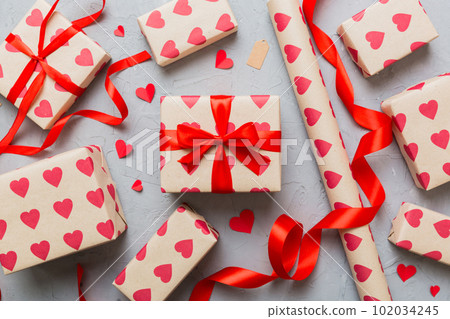 Creative gift box with decorations for the holiday, top view. Birthday and valentine present Creative gift box with decorations for the holiday, top view. Birthday and valentine present 102034245