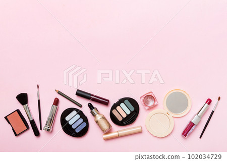 Professional makeup tools. Top view. Flat lay. Beauty, decorative cosmetics. Makeup brushes set and color eyeshadow palette on table background. Minimalistic style Professional makeup tools. Top view. Flat lay. Beauty, decorative cosmetics. Makeup brushes set and color eyeshadow palette on table background. Minimalistic style 102034729