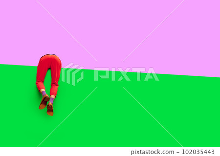 Male legs in red pants and classical shoes over vivid purple and green background. Empty space to insert your text 102035443