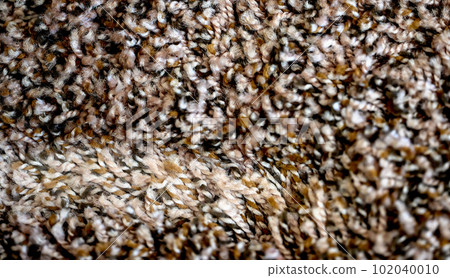 Compressed area of carpet with indentation where heavy furniture sat for a long period.  102040010