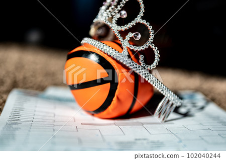 Basketball, tiara, and blank bracket signifying a Cinderella season. Basketball, tiara, and blank bracket signifying a Cinderella season. 102040244
