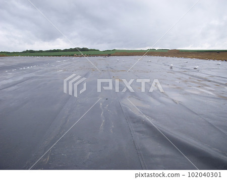 Landfill expansion project with unrolled HDPE synthetic liner. Landfill expansion project with unrolled HDPE synthetic liner. 102040301