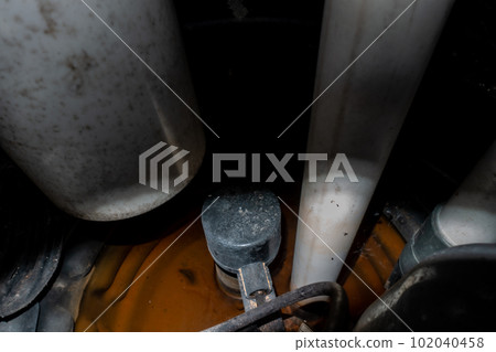 interior view of dark sump pit with pump and float switch visible in dim light 102040458