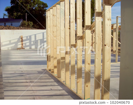 Wall frame being built on a slab-on-grade single story berm home.  102040670