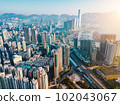 Aerial city view with crossroads and roads, houses, buildings and parking lots. Helicopter drone shot. Wide Panoramic image. - Image 102043067