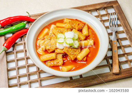 Tteokbokki, Stir-fried Rice Cake : Sliced rice cake bar (garaetteok) or thin rice cake sticks (Tteokbokkitteok) stir-fried in a spicy gochujang sauce with vegetables and fish cakes. Tteokbokki, Stir-fried Rice Cake : Sliced rice cake bar (garaetteok) or thin rice cake sticks (Tteokbokkitteok) stir-fried in a spicy gochujang sauce with vegetables and fish cakes. 102043580