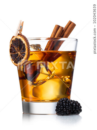 Old fashioned whiskey cocktail with dry orange,cinnamon Old fashioned whiskey cocktail with dry orange,cinnamon 102043639