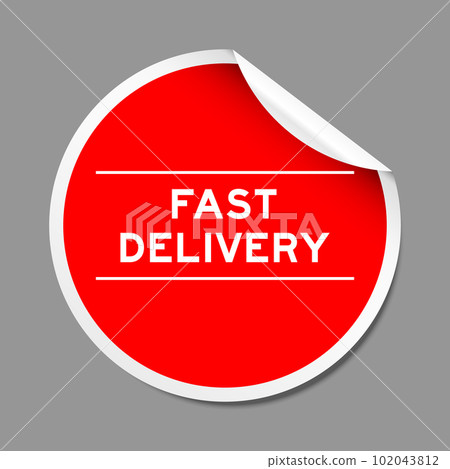 Red color peel sticker label with word fast delivery on gray background Red color peel sticker label with word fast delivery on gray background 102043812