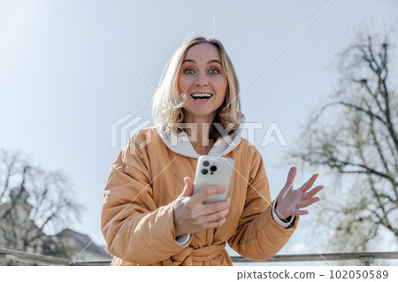 A beautiful young stylish woman walking in the city Spring mood dreaming and waiting a lifestyle concept A beautiful young stylish woman walking in the city Spring mood dreaming and waiting a lifestyle concept 102050589