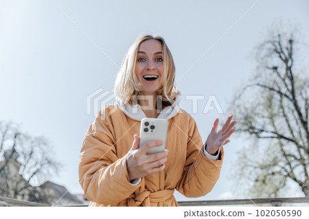 A beautiful young stylish woman walking in the city Spring mood dreaming and waiting a lifestyle concept A beautiful young stylish woman walking in the city Spring mood dreaming and waiting a lifestyle concept 102050590