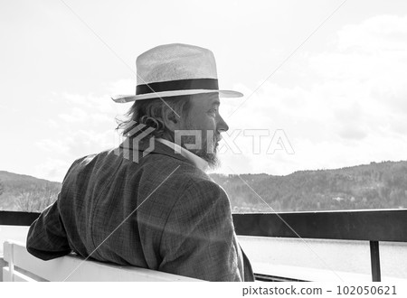 Portrait of a confident, handsome, mature man, pensioner, grandfather in the small town Portrait of a confident, handsome, mature man, pensioner, grandfather in the small town 102050621