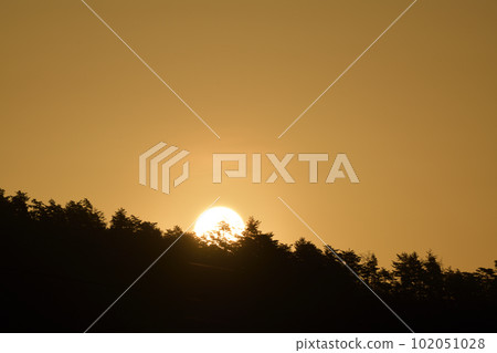 The sun rising in the reddish yellow sky in Hakushu Town, Hokuto City The sun rising in the reddish yellow sky in Hakushu Town, Hokuto City 102051028
