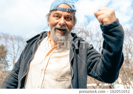 Portrait of a confident, handsome, mature man, pensioner, grandfather in the small town Portrait of a confident, handsome, mature man, pensioner, grandfather in the small town 102051052