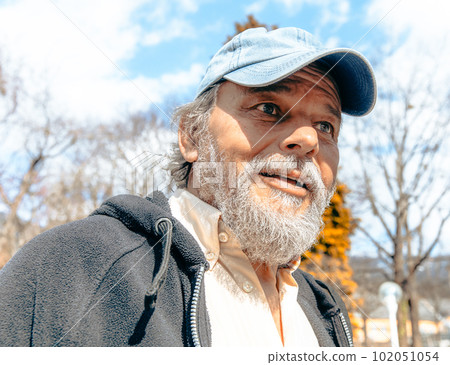 Portrait of a confident, handsome, mature man, pensioner, grandfather in the small town Portrait of a confident, handsome, mature man, pensioner, grandfather in the small town 102051054