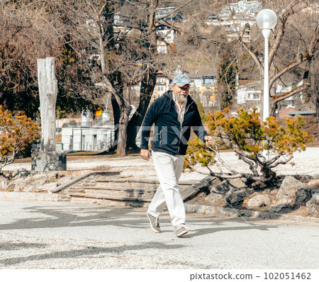 Portrait of an elderly person running in the park, active ageing and lifestyles Portrait of an elderly person running in the park, active ageing and lifestyles 102051462