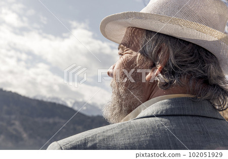 Portrait of a confident, handsome, mature man, pensioner, grandfather in the small town 102051929