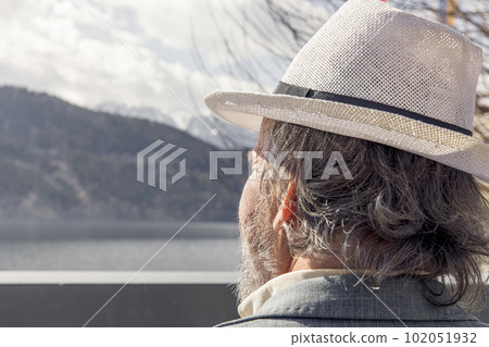 Portrait of a confident, handsome, mature man, pensioner, grandfather in the small town Portrait of a confident, handsome, mature man, pensioner, grandfather in the small town 102051932