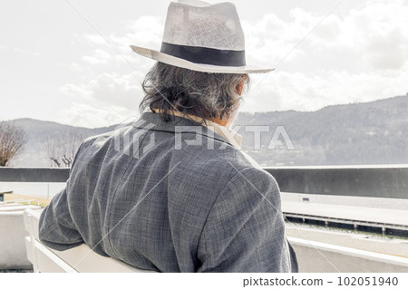 Portrait of a confident, handsome, mature man, pensioner, grandfather in the small town Portrait of a confident, handsome, mature man, pensioner, grandfather in the small town 102051940