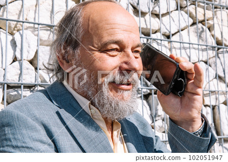 Portrait of a confident, handsome, mature man, pensioner, grandfather in the small town Portrait of a confident, handsome, mature man, pensioner, grandfather in the small town 102051947