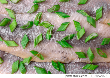 Delicious Atlantic herring marinated with salt and spices 102052028