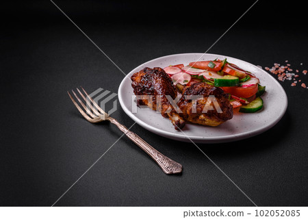Delicious nutritious dish consisting of grilled chicken legs with a salad Delicious nutritious dish consisting of grilled chicken legs with a salad 102052085