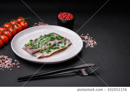 Delicious Atlantic herring marinated with salt and spices Delicious Atlantic herring marinated with salt and spices 102052156