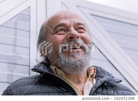 Portrait of a confident, handsome, mature man near his house Portrait of a confident, handsome, mature man near his house 102052306