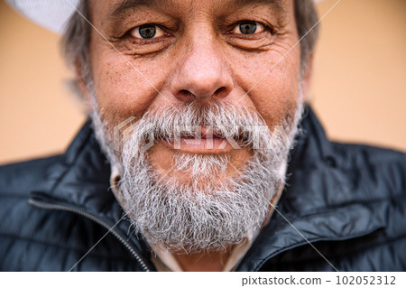 Portrait of a confident, handsome, mature man, pensioner, grandfather near his house, anti aging activities Portrait of a confident, handsome, mature man, pensioner, grandfather near his house, anti aging activities 102052312