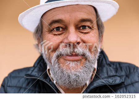 Portrait of a confident, handsome, mature man, pensioner, grandfather near his house, anti aging activities Portrait of a confident, handsome, mature man, pensioner, grandfather near his house, anti aging activities 102052315