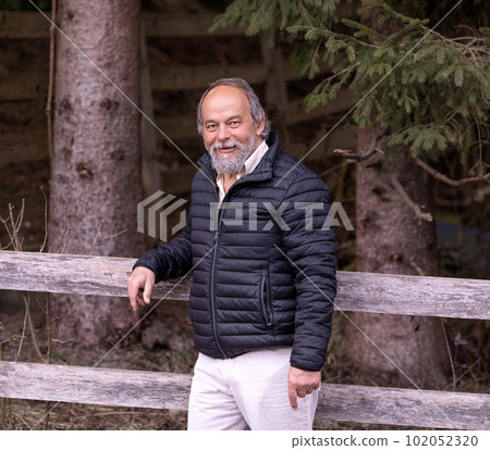 Portrait of a confident, handsome, mature man, pensioner, grandfather, anti aging activities Portrait of a confident, handsome, mature man, pensioner, grandfather, anti aging activities 102052320