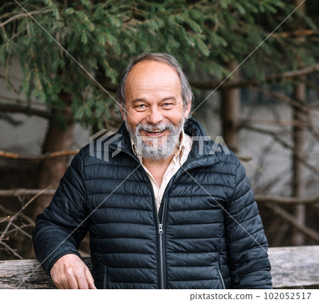Portrait of a confident, handsome, mature man, pensioner, grandfather, anti aging activities 102052517
