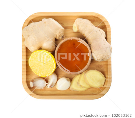 Fresh garlic and other natural cold remedies isolated on white, top view Fresh garlic and other natural cold remedies isolated on white, top view 102053162