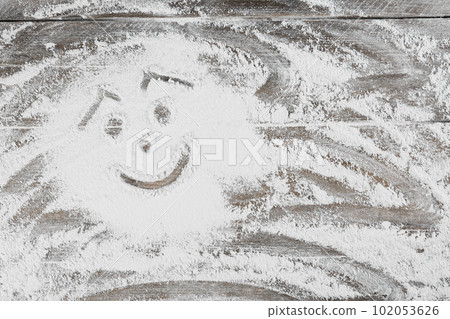 Smiling face made with flour on wooden table, top view. Space for text Smiling face made with flour on wooden table, top view. Space for text 102053626