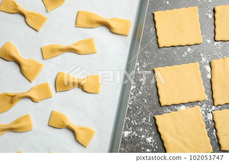 Homemade farfalle pasta on grey table, flat lay Homemade farfalle pasta on grey table, flat lay 102053747