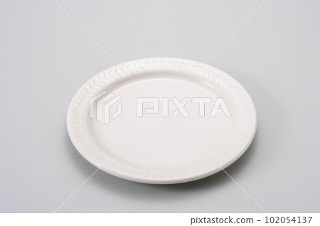 A white round plate placed on a white background 102054137
