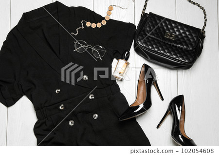 Flat lay composition with stylish clothes on white wooden background Flat lay composition with stylish clothes on white wooden background 102054608