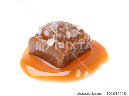 Delicious salted caramel with sauce on white background 102054638