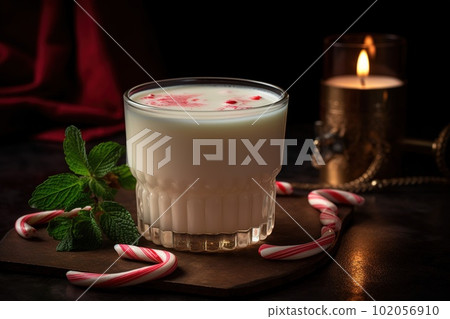 A chilly, peppermint-infused cocktail, featuring a creamy, white chocolate liqueur-based drink, served in a frosty glass with a candy cane set against a snowy, holiday-inspired backdrop. Generative Ai A chilly, peppermint-infused cocktail, featuring a creamy, white chocolate liqueur-based drink, served in a frosty glass with a candy cane set against a snowy, holiday-inspired backdrop. Generative Ai 102056910