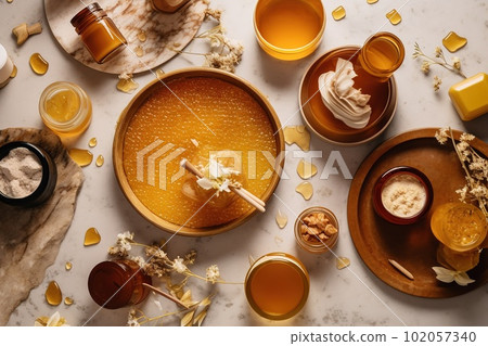 Honey-themed spa setting, highlighting the use of honey as a natural skincare ingredient, honey-infused products, face masks, body scrubs, moisturizers, on relaxation-focused backdrop. Generative AI Honey-themed spa setting, highlighting the use of honey as a natural skincare ingredient, honey-infused products, face masks, body scrubs, moisturizers, on relaxation-focused backdrop. Generative AI 102057340