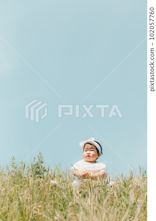 girl sitting on the bank 102057760