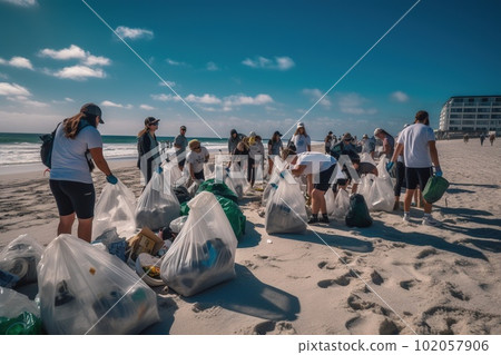 A group of volunteers wearing gloves and carrying reusable bags participate in a beach cleanup event. They are collecting plastic waste, including bottles, bags, and other debris. Generative AI 102057906