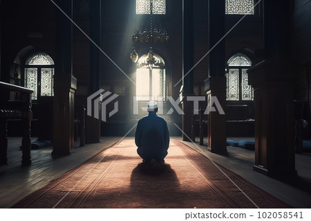 A man praying at a mosque. Man s devotion as he prays. The mosque be shown in the background to emphasis on the spiritual aspect of Ramadan. Generative AI. 102058541