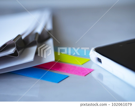 Documents and smartphone on the table Documents and smartphone on the table 102061079