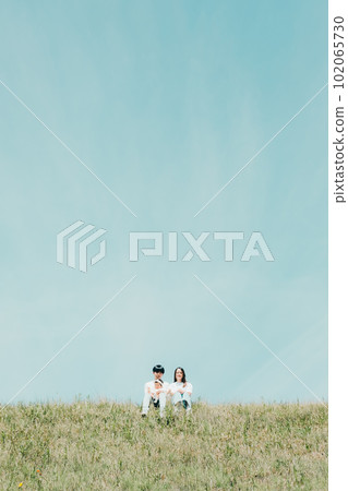 family sitting on the bank family sitting on the bank 102065730