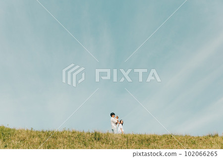 family walking along the bank 102066265
